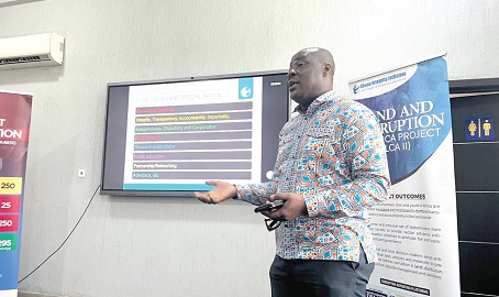 Michael Okine, Coordinator, Land and Corruption in Africa Project of Transparency International, explaining a point at the forum Michael Okine, Coordinator, Land and Corruption in Africa Project of Transparency International, explaining a point at the forum