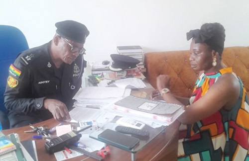 Chief Superintendent Vincent Adotey (left) explaining the details to Beatrice Laryea, Daily Graphic Reporter Chief Superintendent Vincent Adotey (left) explaining the details to Beatrice Laryea, Daily Graphic Reporter