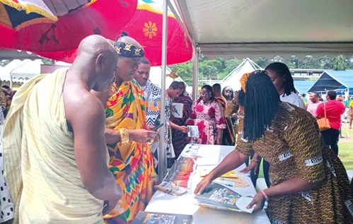 Odeefuo Amoakwa Buadu (2nd from left), President of the Central Regional House of Chiefs, at one of the exhibition booths