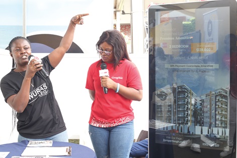 A representative of JL Properties explaining issues to Abena Arhin, a Daily Graphic Correspondent