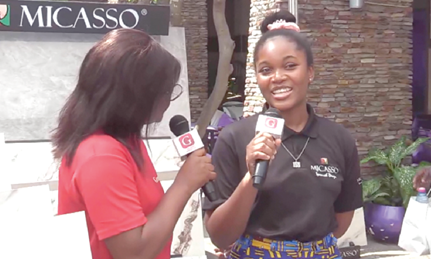 A staff member of Micasso (right) speaking about the company’s products at the fair