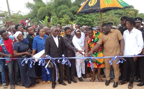 Dr Frank Amoakohene (2nd from right), Ashanti Regional Minister, together with Nana Owusu Adade (3rd from right) and Alhassan Suhuyini (4th from right), cutting the tape to open the bridge