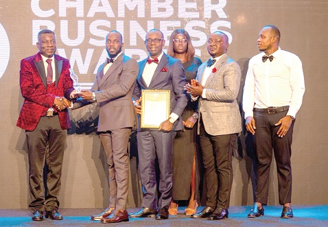 Robert Kwabena Ayitey (2nd from left), Managing Director of BH-Fetagro, receiving the award