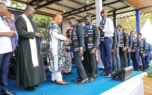 Samuel Okudzeto Ablakwa (3rd from left), Minister of Foreign Affairs, with Rt Rev. Dr Abraham Nana Opare Kwakye (2nd from left), Moderator of the General Assembly, Presbyterian Church of Ghana, and Dr Ernest Ofori Sarpong (left), Board Chairman and Global President, Presbyterian Boys' Senior High School, presenting medals to the students who attained 8A’s in the WASSCE. Picture: ELVIS NII NOI DOWUONA 