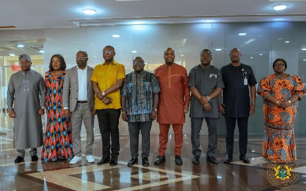 Julius Debrah (middle), Chief of Staff, with members of the Ministerial Oversight Committee after the inauguration at Jubilee House