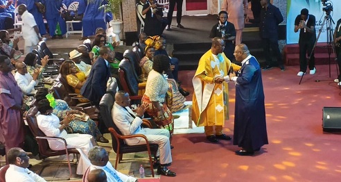 Archbishop Nicholas Duncan-Williams ( standing right), Founder  of Action Chapel International, with Most Rev. Dr Samuel Noi Mensah, outgoing Bishop of the FGCI,  during the event