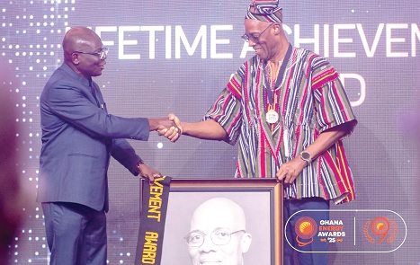 Jabesh Amissah-Arthur (right) receiving  his award from Prof. Alex Asante, an awarding panellist 