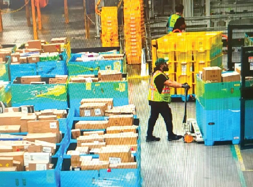 • Workers moving products during Cyber Monday at Amazon's fulfilment center in Robbinsville, New Jersey, U.S