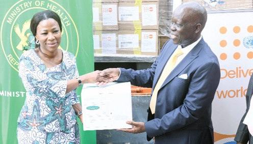 Dr Grace Ayensu-Danquah (left), Deputy Minister of Health, receiving a sample of the medical items for some health institutions in Ghana from Dr Wilfred Ochan, Country Representative, UNFPA.  Picture: SAMUEL TEI ADANO