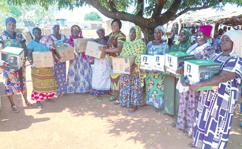 Some of the beneficiaries displaying the cookstoves