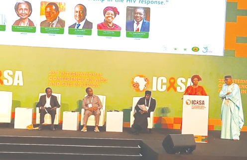 Prof. Sheila Tlou (right), a board member of Society for AIDS in Africa, addressing the delegates and dignitaries at the SAA's 35th anniversary celebration while the other panellists look on