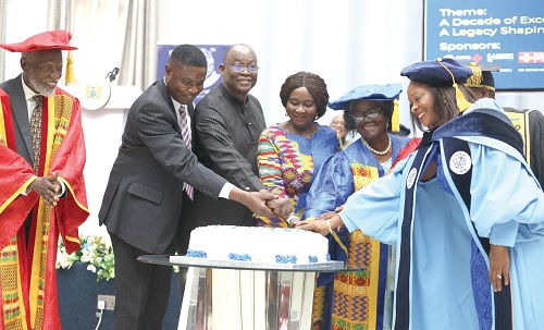 Prof. Naana Jane Opoku-Agyemang (3rd from right), Vice-President, cutting the 10th anniversary cake. With her are Dr Naa Dede Hesse (right), Registrar, ACM; Prof. Jane Hesse (2nd from right), President, ACM; Emeritus Prof. Stephen Adei (left), Council Chairman, ACM, and Ekwow Spio-Garbrah (3rd from left), Chairman of the Africa Education Trust Fund. Picture: BENEDICT OBUOBI