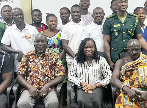 Pamela Laourou (seated middle), Assistant Communications Officer of GACC, with participants