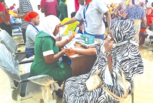 A nurse attending to a beneficiary
