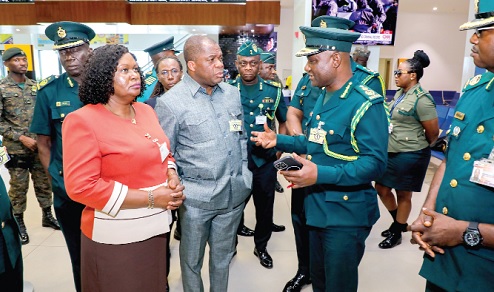 Samuel Basintale Amadu (2nd from right), Comptroller-General, Ghana Immigration Service, explaining a point to Rev. Dr Stephen Yenusom Wengam (2nd from left), Chairman, Immigration Service Council, and Doreen Panyin Annan (left), Chief Director, Ministry of the Interior, during a working visit to Kotoka International Airport. Picture: ELVIS NII NOI DOWUONA 