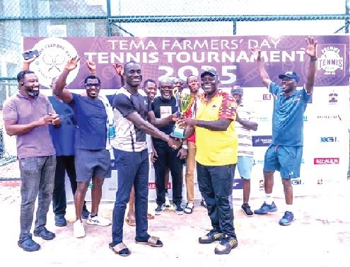 Isaac Aboagye Duah, President of the Ghana Tennis Association, presenting the winner’s trophy to the Sakumono Tennis Club