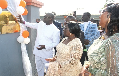 Rt Rev. Dr Abraham Nana Opare Kwakye, Moderator of General Assembly, PCG, unveiling the plaque for the newly named ROSEMOND BAMPO HOUSE. With him are other officials