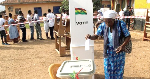 A voter casting her ballot in a general election