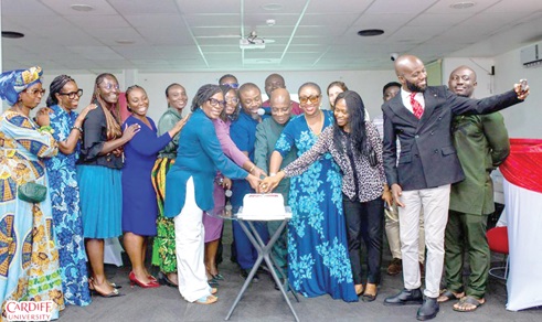 Cardiff University graduates cutting a cake to mark the official launch of the Alumni Association in Ghana
