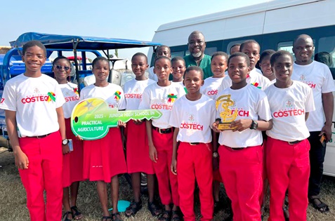 Nathaniel Adams, founder of the school, with some of the students displaying the award prizes at the event