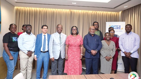  Obuobia Darko-Opoku (middle), Administrator of the Ghana Medical Trust Fund, and her team with officials of KGL