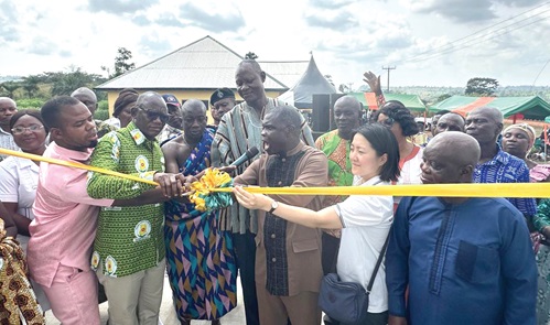 Emmanuel Kwesi Lawer, the District Chief Executive for Upper Manya Krobo,  being assisted by dignitaries to inaugurate the nurses’ quarters. INSET: The three-bedroom nurses’ quarters