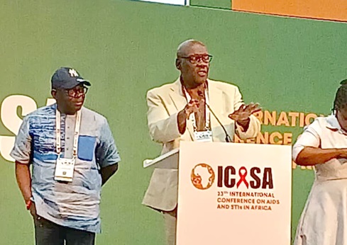 Dr David Parirenyatwa Pagwesese, SAA President, launching the maiden scientific journal of SAA. Looking on is  Luc Armand Bodea, SAA Coordinator and ICASA Director