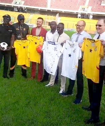 • Will Stevens (2nd from right) with Rolf Olson (right) and some former Black Stars players displaying replica jerseys