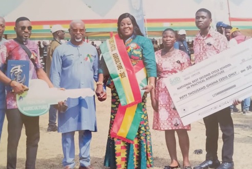 Brigitte  Dzakah (middle), headmistress, with staff of the school after the programme