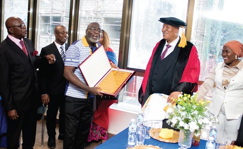 Rev. Francis Dadzie (3rd from left), President of the UPSA Global Alumnni, presenting the citation to Prof. Alabi (2nd from right). With them are other members of the association