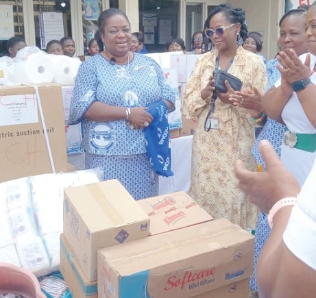 Lynda  Dede Graham (left), Global and National President of St Mary's SHS Old Girls Association,  presenting the items to Prof. Catherine Segbefia, Head Of Departent, Child Health Deptment of the KBTH