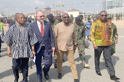 President John Dramani Mahama (2nd from right);  Samuel Okudzeto Ablakwa (left), Foreign Affairs Minister;  Rolf Olson (2nd from left), the Charge d’Affaires of the US Embassy,  and Ernest Brogya Genfi (right),  Deputy Minister of Defence, seeing the soldiers off