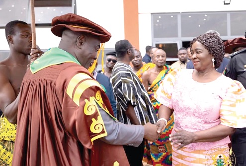 Osagyefo Oseadeeyo Agyeman Badu II (left), Dormaahene, exchanging pleasantries with Prof. Naana Jane Opoku-Agyemang  after the congregation 