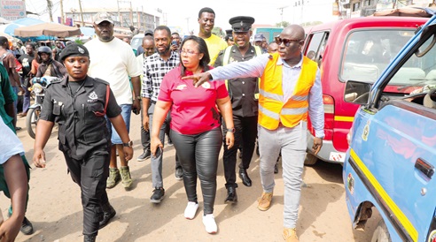 Ibrahim Faila Fuseini (right), Municipal Chief Executive, La Nkwantanang-Madina Municipal Assembly, explaining a point to Linda Akweley Ocloo (2nd from right), Greater Accra Regional Minister, during a working visit to the municipality. Picture: ELVIS NII NOI DOWUONA 