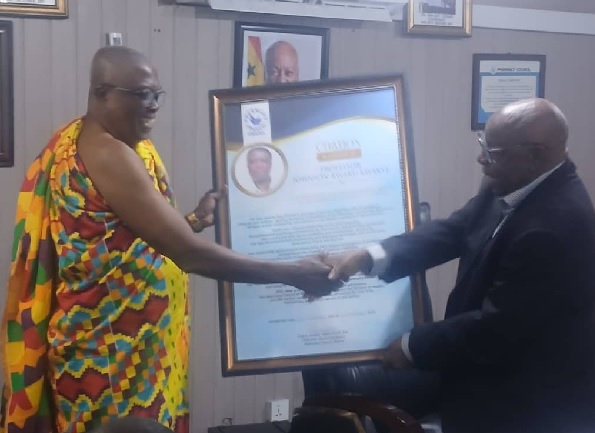 Hon. Yieleh Chireh, Chairman of the Pharmacy Council Governing Board presenting the citation to Prof. Johnson Kwaku Kwakye