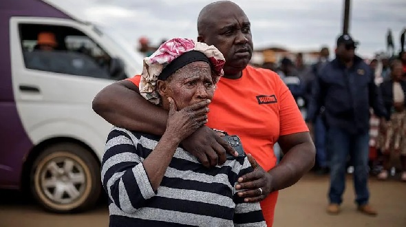 Bekkersdal residents at the scene of the shooting