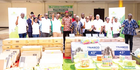 The management of Ntiamoah Foundation, some chiefs, staff of the Birim North District Education Directorate and teachers of the beneficiary schools during the presentation of assorted items to basic schools