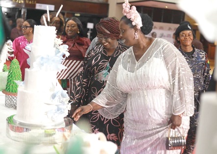 Efua Goode-Obeng Kyei (right), Director of EKGS Culinary Institute, and Abla Dzifa Gomashie, Minister of Tourism, Culture and Creative Arts, admiring the works of the graduates during the exhibition