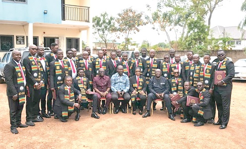 Henry Kwadwo Boateng (seated 3rd from left), outgoing President of the Institution of Engineering and Technology, Ghana, with the inductees