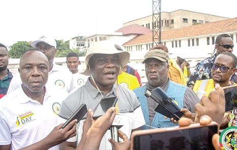 Ahmed Ibrahim, Minister of Local Government, Chieftaincy and Religious Affairs, addressing journalists during the clean up exercise
