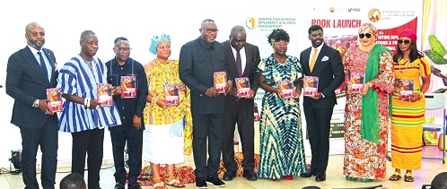 Dr Samuel Ofosu Ampofo (5th from left), Board Chairman, COCOBOD, with Prof. Lord Mawuko Yevugah (3rd from left), the Director, Centre for African Diplomacy and Global Engagement and author of the book, Dr Philip Abradu-Otoo (5th from right), the Director, Research, BoG, other dignitaries and participants.   Picture: ERNEST KODZI 