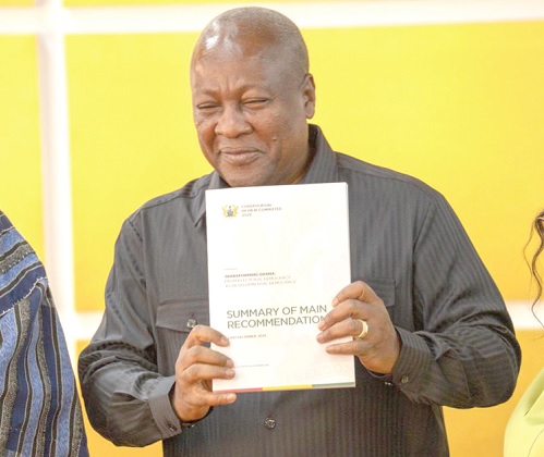 President John Dramani Mahama with the report 