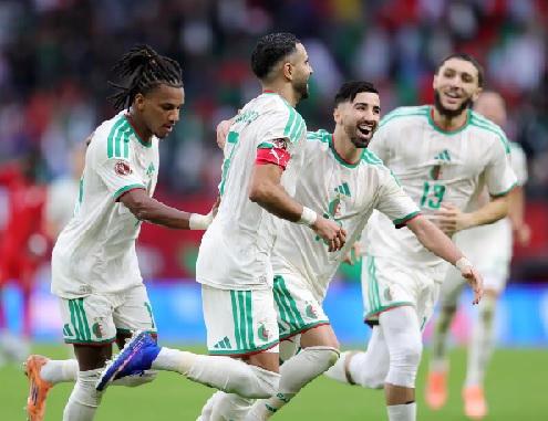 Riyad Mahrez and teammates celebrating Algeria's victory over Sudan