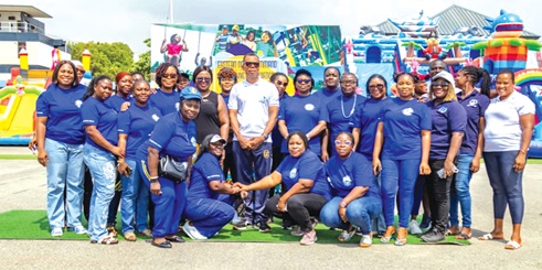 Commodore Solomon Asiedu-Larbi (arrowed), Flag Officer Commanding, flanked on his right by Esther Kwakye Agyapong, wife of the Chief of the Defence Staff, and on his left by Gifty Agnes Bessing, President of NAWA and wife of the Chief of the Naval Staff, and other members of the association