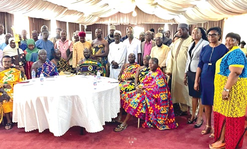 Barima Ogyeabour Amankwaah Adunan II (seated middle), the Kuntanasehene, and some dignitaries in a group photograph after the event in Kumasi. Those with them include Charity Baature (standing right), the Upper West Regional Gender Officer, Department of Gender