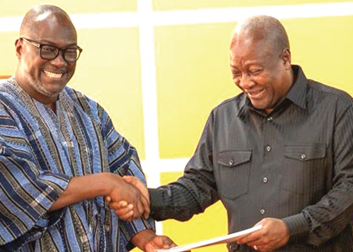 Prof. H. Kwasi Prempeh (left), Chair of the Constitution Review Committee, presenting the report to President John Mahama 