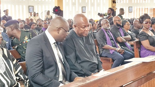 Dr Edward Omane Boamah (left), Minister of Defence, explaining a point to President Mahama during the funeral of the late Lt. Gen. Arnold Quainoo