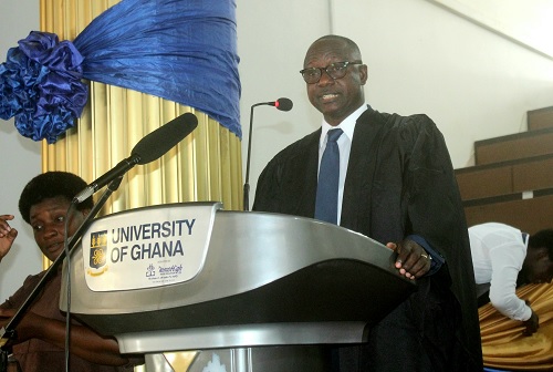 Benedict Fosu Adjei (inset), Registrar, College of Humanities, UG, administering the oath to the matriculants. Picture: ERNEST KODZI