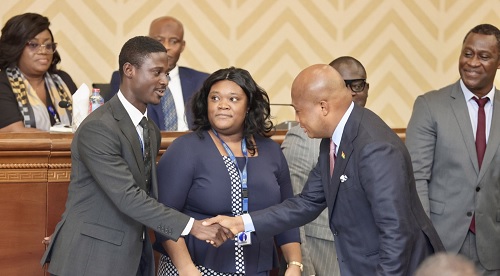 Samuel Okudzeto Ablakwa (2nd from right), the Minister of Foreign Affairs, congratulating members of the committees, including Ramses Joseph Cleland (right), Chief Director of the ministry