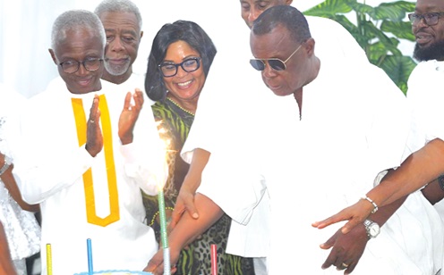 Dr Paul Kofi Fynn (right), Founder and Chancellor of the Wisconsin International University College (WIUC), Ghana, being assisted by Dr Lawrence Kanne (2nd from right), Vice-President WIUC, Faustina Elikplim Akurugu (3rd from right), MP for Dome Kwabenya, and other guests to cut the 85th birthday cake. Picture: ESTHER ADJORKOR ADJEI Dr Paul Kofi Fynn (right), Founder and Chancellor of the Wisconsin International University College (WIUC), Ghana, being assisted by Dr Lawrence Kanne (2nd from right), Vice-President WIUC, Faustina Elikplim Akurugu (3rd from right), MP for Dome Kwabenya, and other guests to cut the 85th birthday cake. Picture: ESTHER ADJORKOR ADJEI